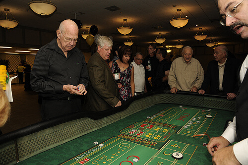 Group of elderly people playing roulette in a casino